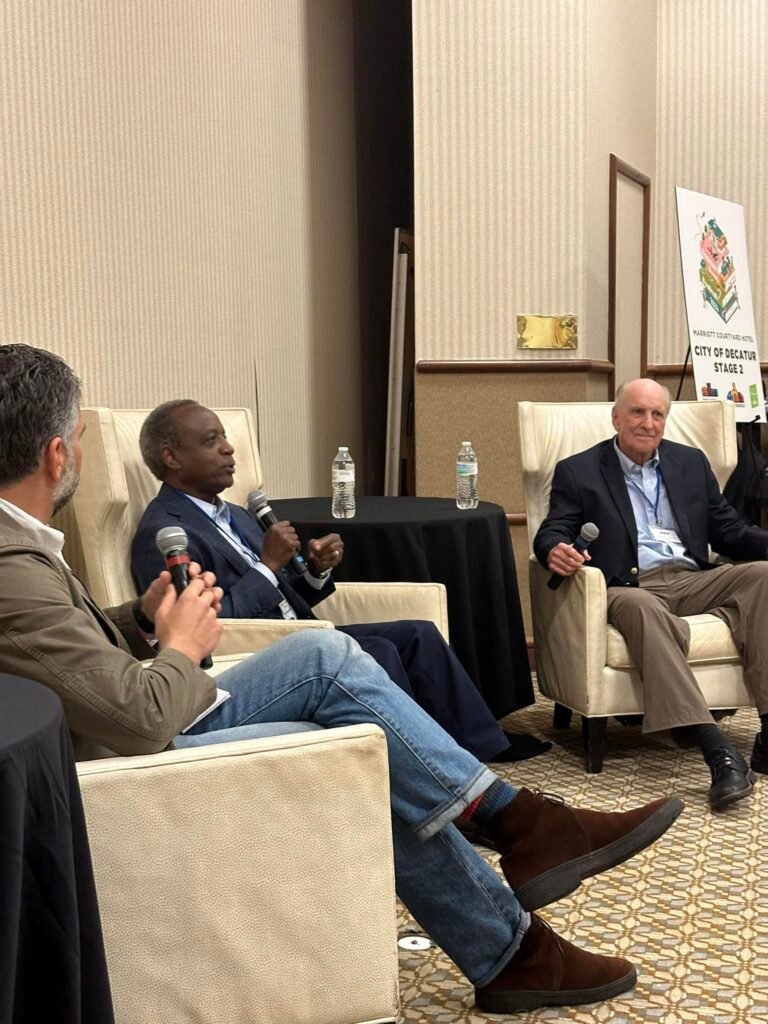 Photo of Keith Pepper, owner and publisher of Rough Draft Atlanta, moderating a discussion between authors Michael L. Thurmond and Paul M. Pressly at the Decatur Book Festival on October 5, 2024.